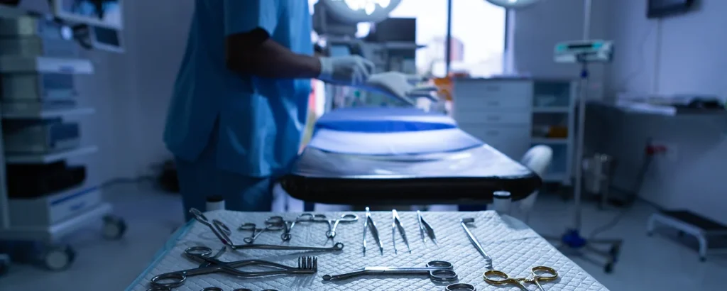 view of operating room centered on the table with all of the tools used for the operation